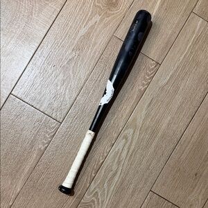 Black Baseball Bat with White Grip